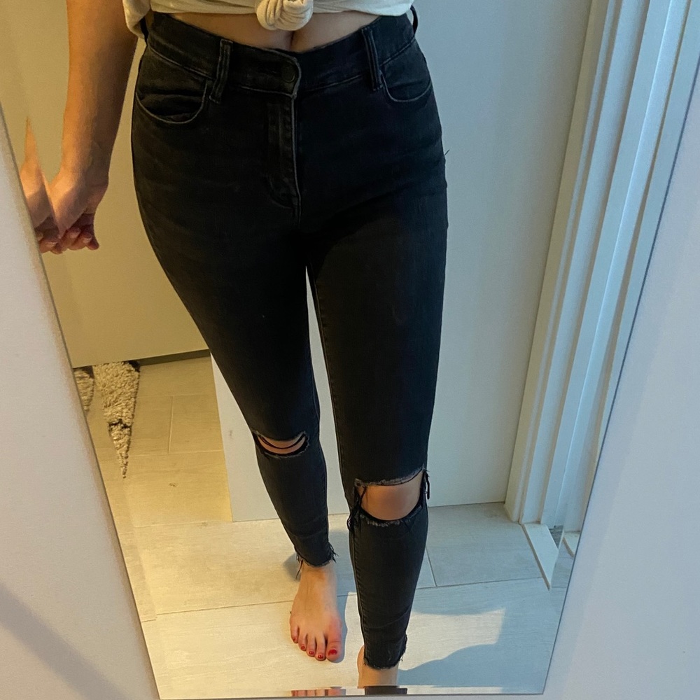 Faded black distressed skinny jeans
